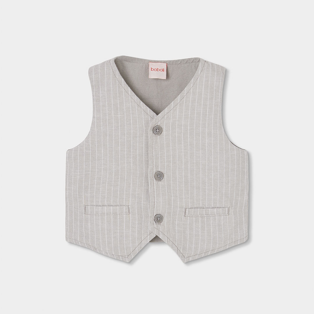 Un gilet raffinato e versatile, perfetto per completare il look elegante dei più piccoli durante ...