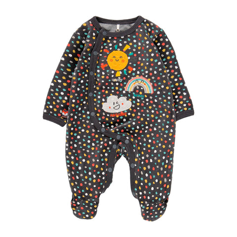 Tutina in ciniglia nera con pois colorati e grafiche di sole e nuvole.