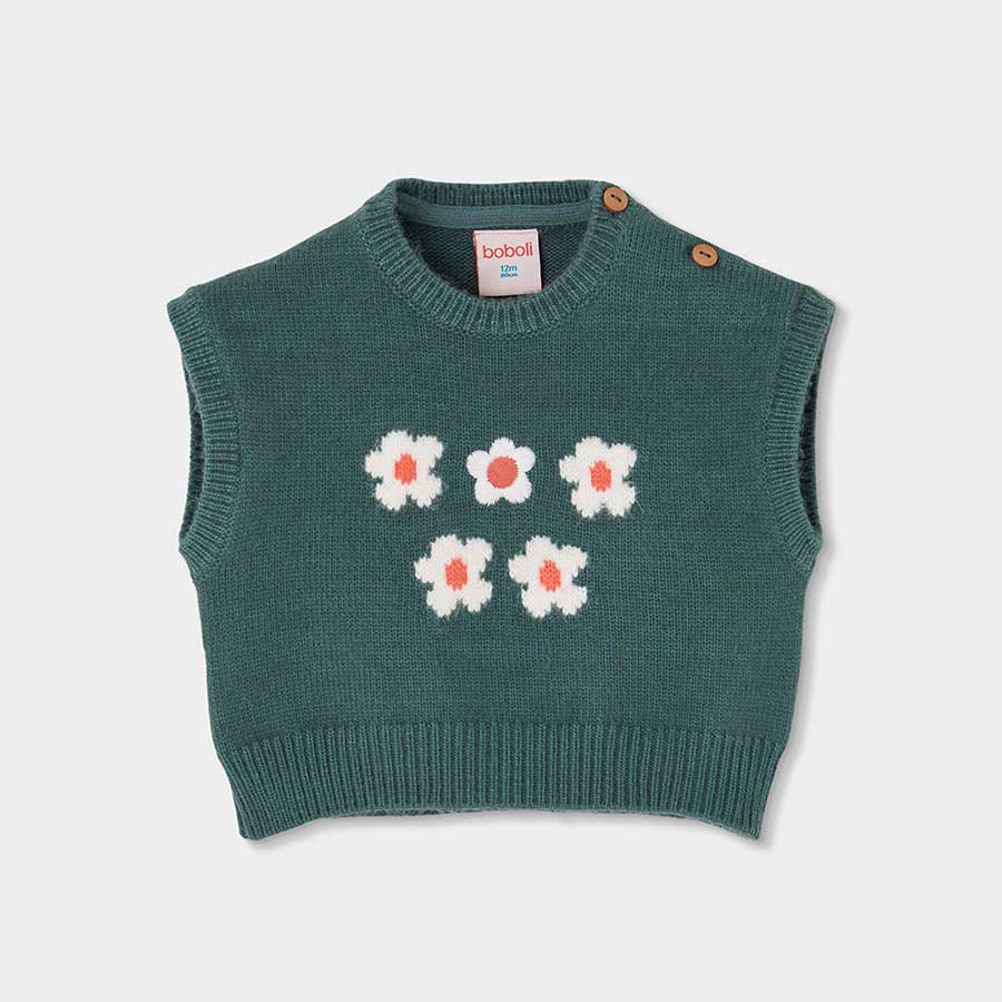 Questo gilet corto in maglia è perfetto per aggiungere un tocco di dolcezza al guardaroba della t...