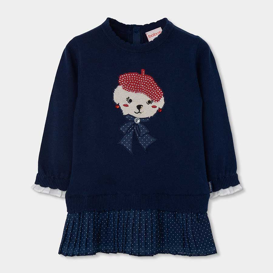 Questo delizioso vestito in maglia unisce comfort e stile per le giornate più fresche. Il dettagl...