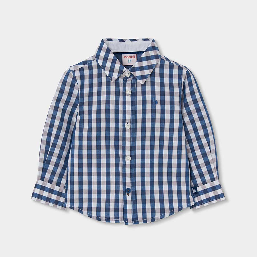Questa camicia a quadri è perfetta per i piccoli esploratori che vogliono un look curato e confor...