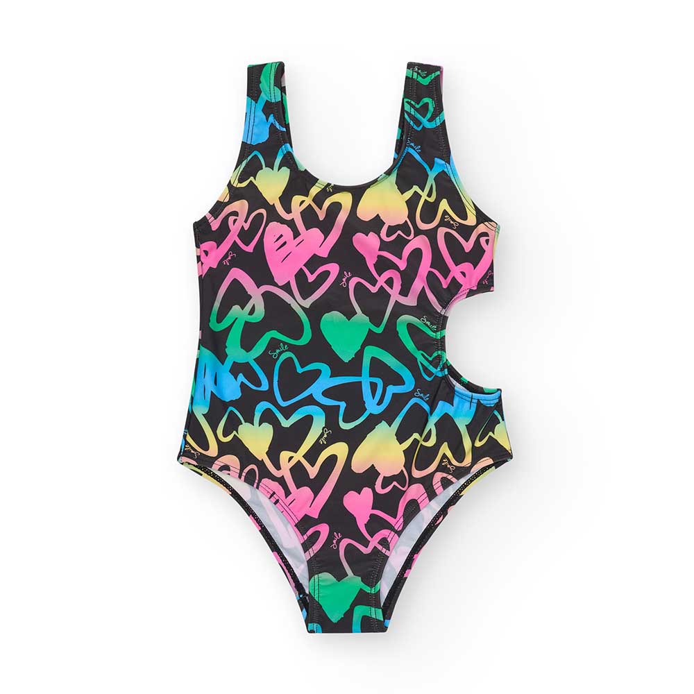 Costume intero della Linea Abbigliamento Bambina Nath Kids, con modello asimmetrico bucato su un ...