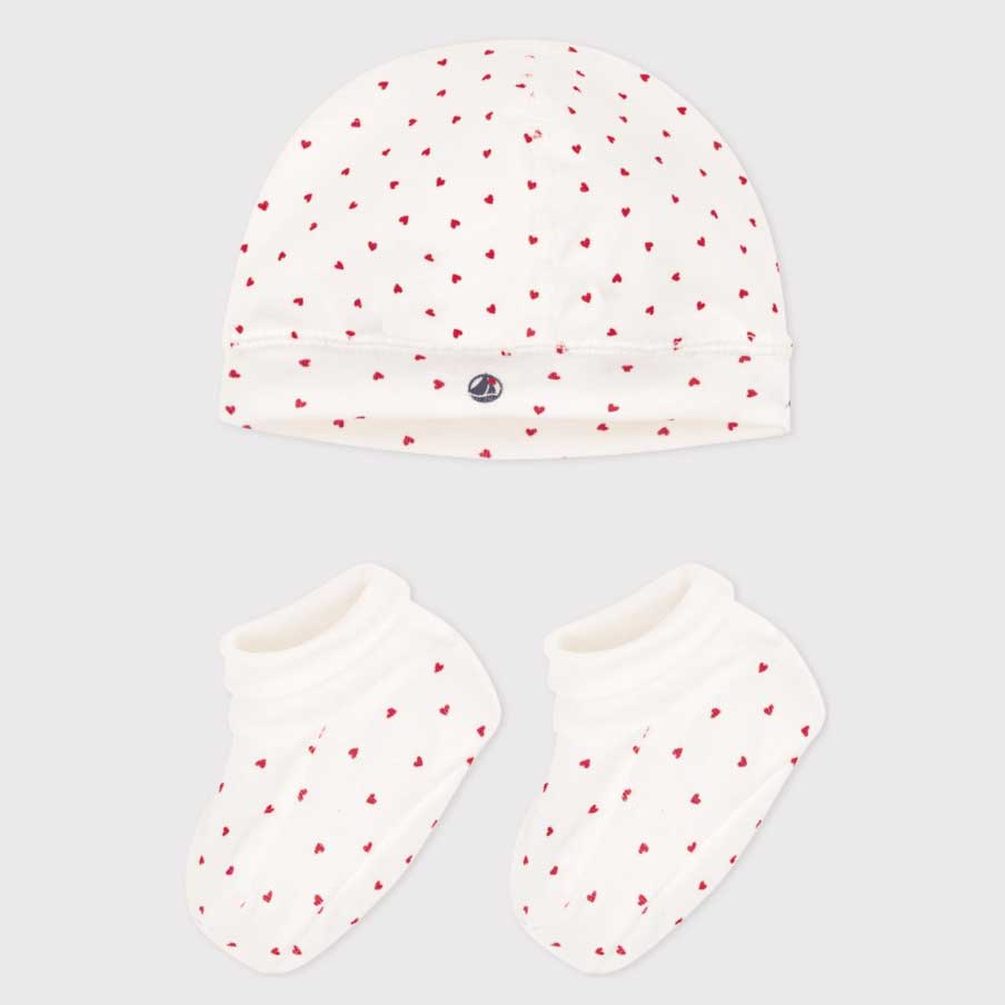 Scopri il dolcissimo set di cappino e scarpine di PETIT BATEAU, perfetto per il tuo piccolo. Ques...