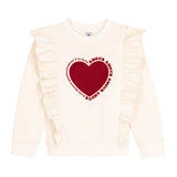 Felpa bianca con ruffles e cuore rosso.