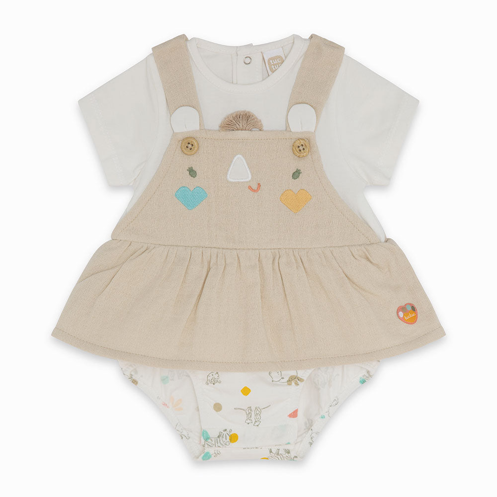 
  Jumpsuit from the Tuc Tuc Girl's Clothing Line buttoned at the bottom and with t-shirt
  solid...