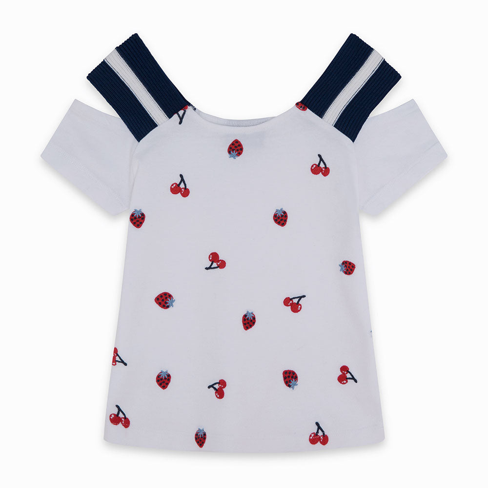Scopri la nostra adorabile T-shirt della linea Tuc Tuc, perfetta per la tua bambina. Con una fant...