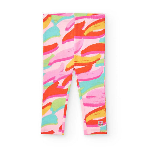 Leggings colorati per bambina con fantasia astratta in tonalità vivaci.
