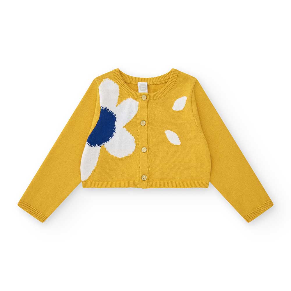 Cardigan from the Tuc Tuc Girls' Clothing Line with a short cut and floral pattern on one side.
C...
