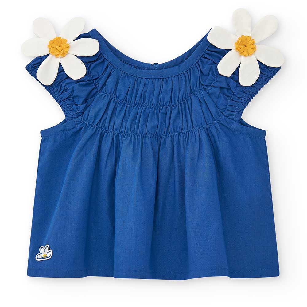 Tuc Tuc Girl's Clothing Line blouse, short model with gathering at the top. Two fabric daisies ar...