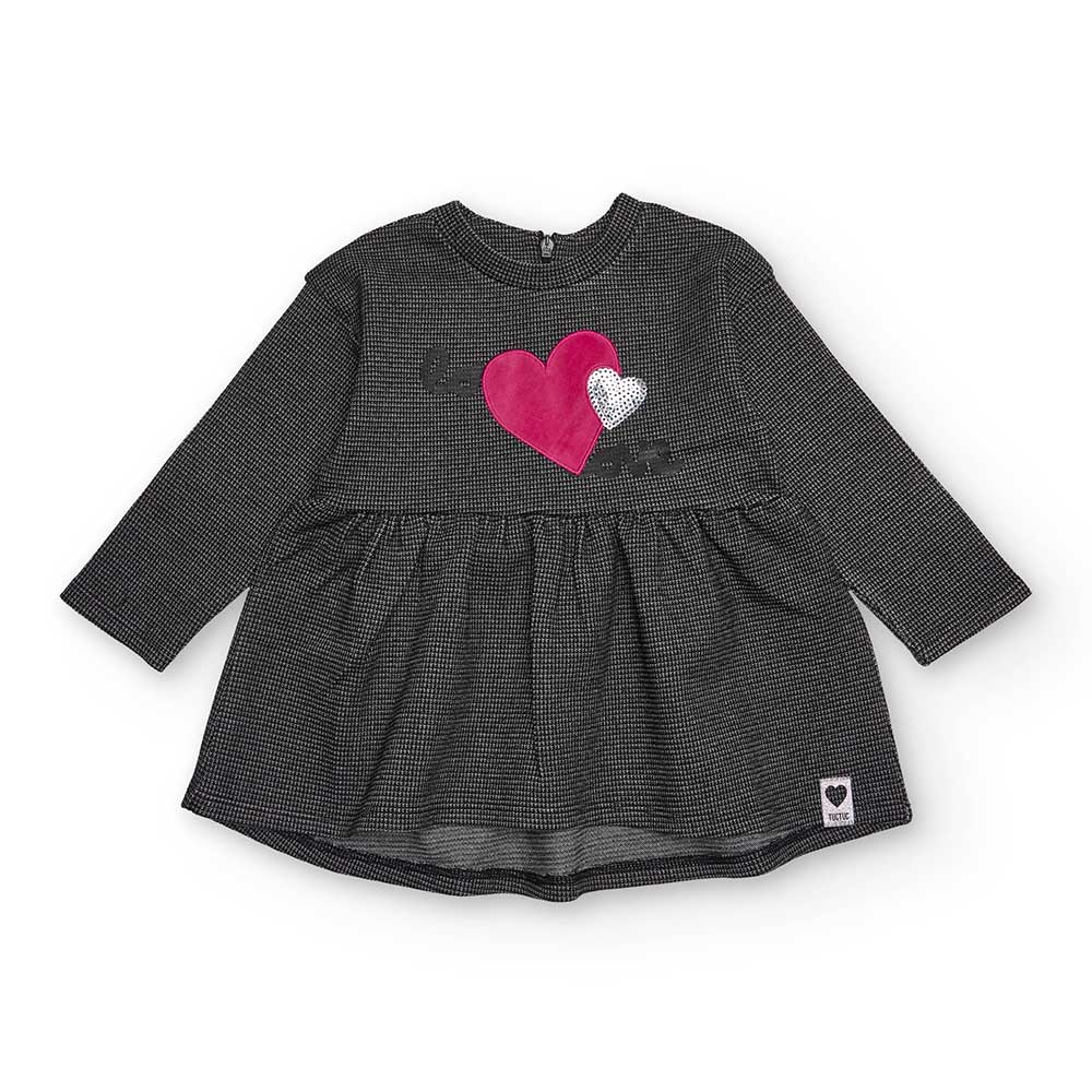 Kleid aus der Kinderbekleidungslinie Tuc Tuc, mit Stoff aus metallisiertem Garn und kleiner Herza...